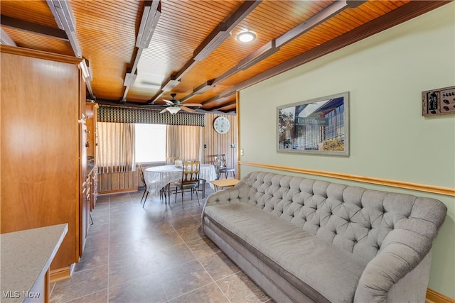 living room featuring ceiling fan, tile patterned flooring, and wooden ceiling