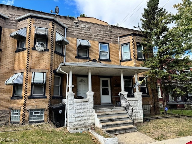 view of property with covered porch