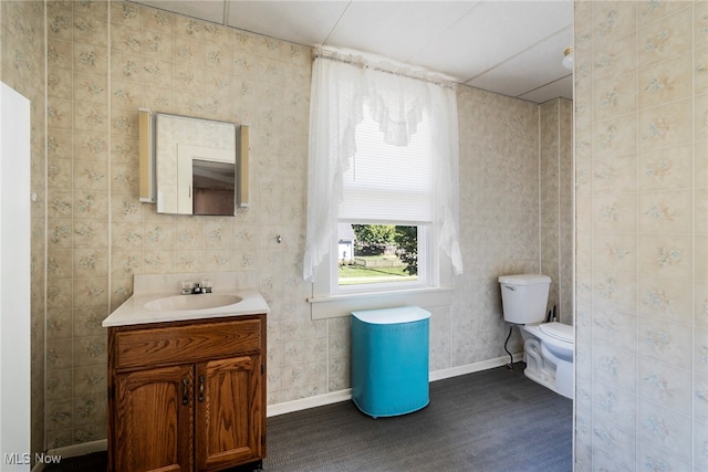 bathroom featuring vanity and toilet