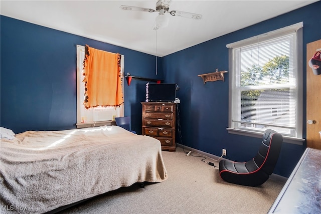 carpeted bedroom featuring ceiling fan