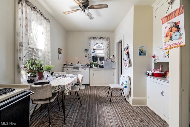 kitchen featuring white cabinets, electric stove, and ceiling fan