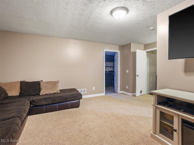 living room featuring light colored carpet and a textured ceiling