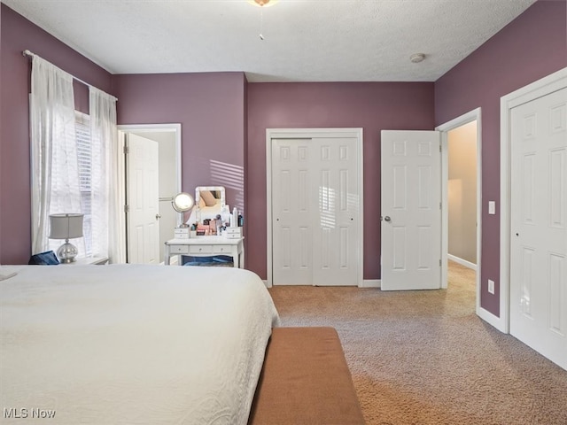 carpeted bedroom with a textured ceiling