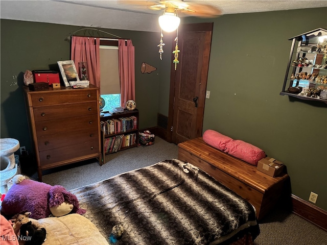 bedroom featuring carpet, a textured ceiling, and ceiling fan