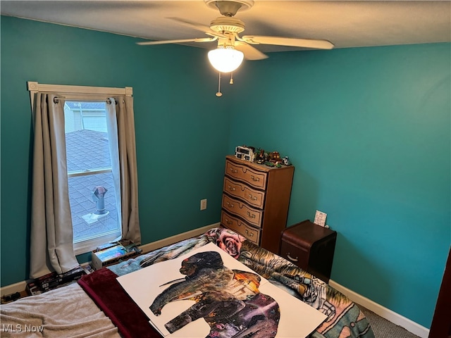 carpeted bedroom with ceiling fan