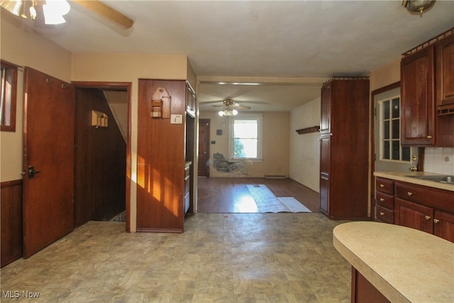 kitchen with ceiling fan, backsplash, and light hardwood / wood-style floors