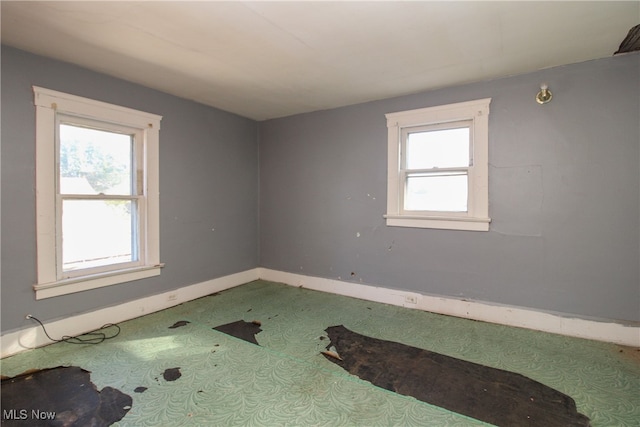 spare room featuring plenty of natural light