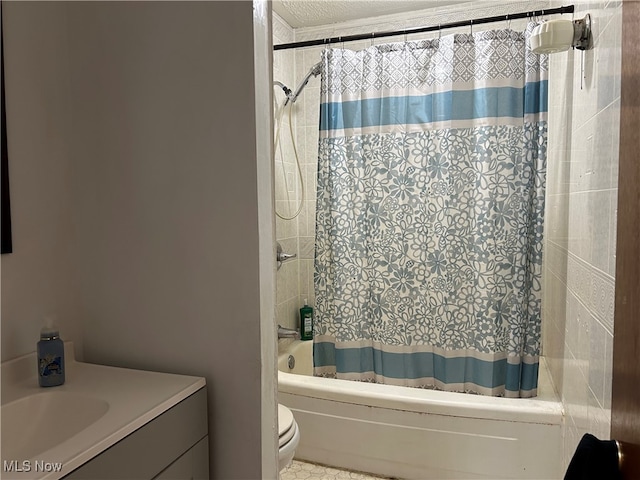 full bathroom featuring shower / bath combo, vanity, and toilet