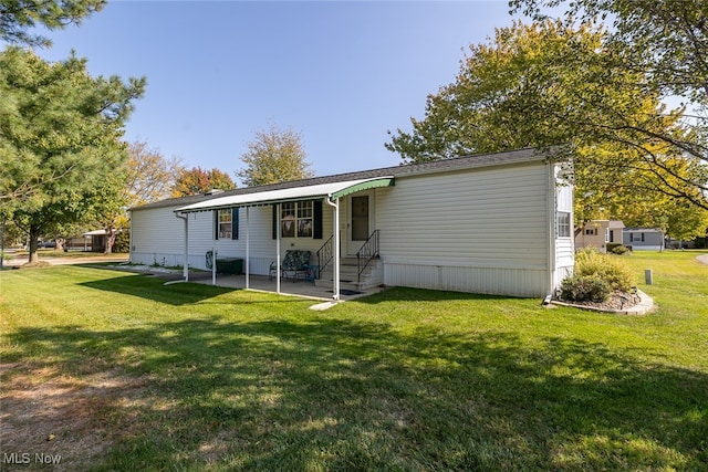 back of house featuring a yard