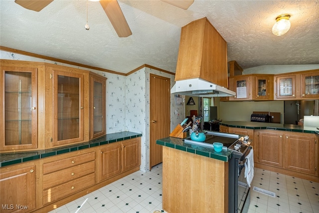 kitchen with ornamental molding, range with electric cooktop, vaulted ceiling, and a textured ceiling