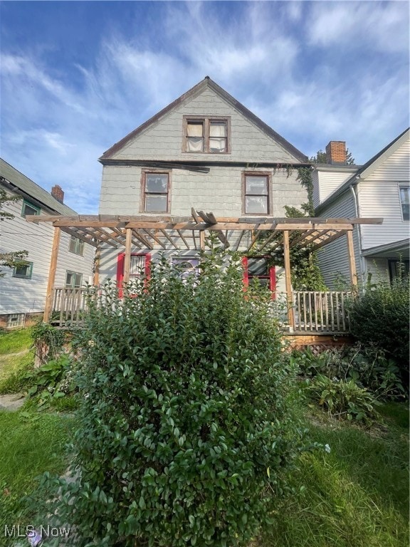 view of front of home with a pergola