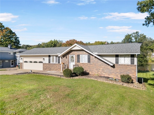 ranch-style home with a front yard and a garage