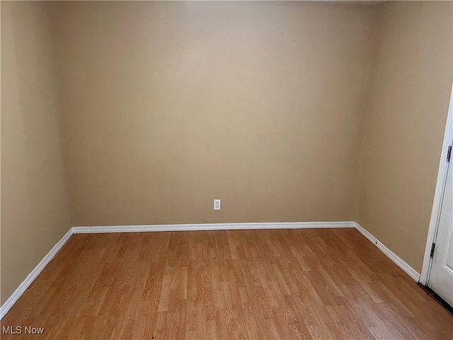 spare room featuring light hardwood / wood-style floors