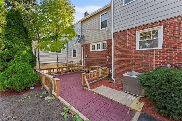 view of patio / terrace with a deck and central air condition unit