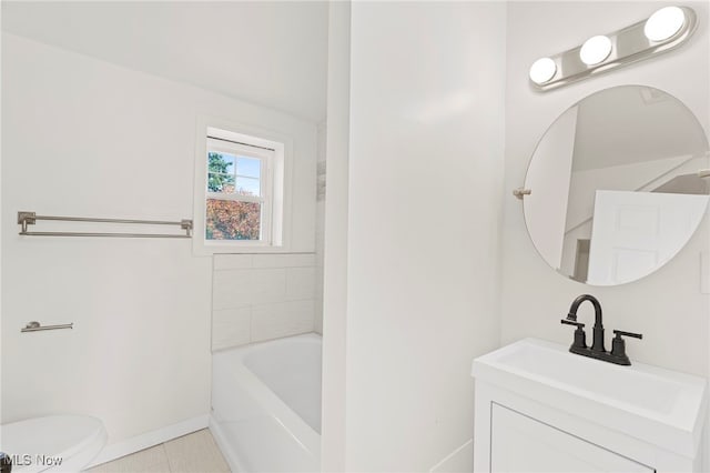 bathroom with vanity, tile patterned flooring, and toilet