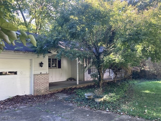 view of side of home with a garage