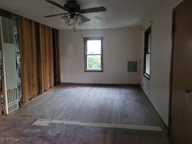 spare room with wood-type flooring and ceiling fan