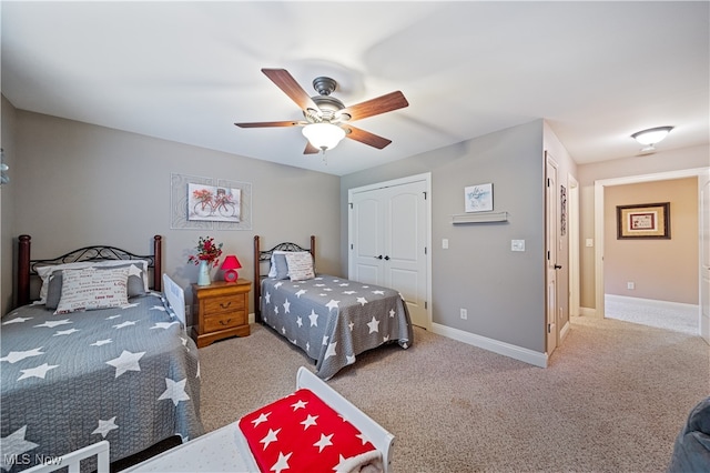 carpeted bedroom with a closet and ceiling fan