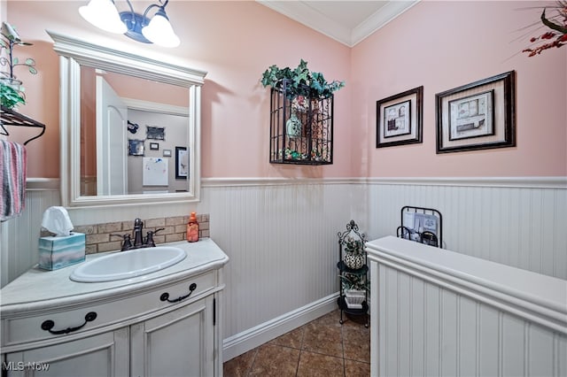 bathroom featuring vanity, tile patterned flooring, and ornamental molding