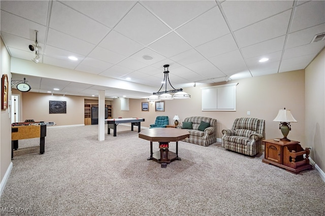 playroom with a drop ceiling and carpet floors