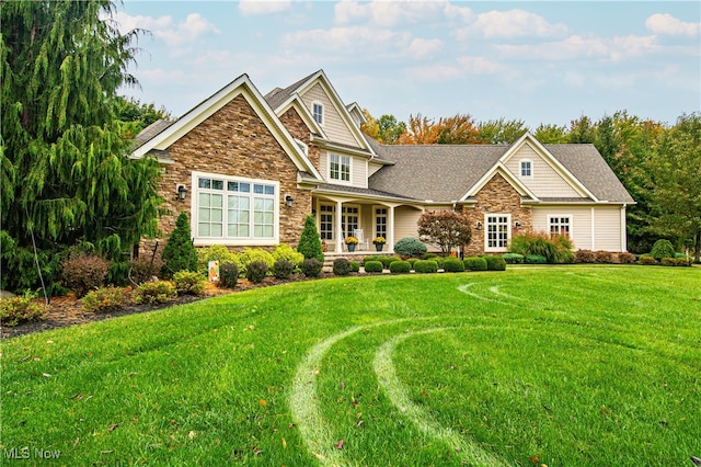 craftsman-style home with a front yard