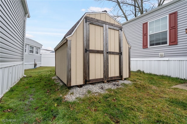 view of outdoor structure with a lawn