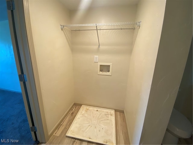 laundry area with washer hookup and hardwood / wood-style floors