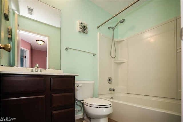 full bathroom featuring bathing tub / shower combination, vanity, and toilet