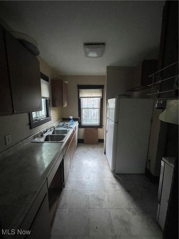 kitchen with white refrigerator and sink