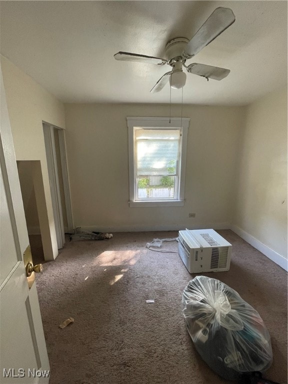 empty room with carpet floors and ceiling fan