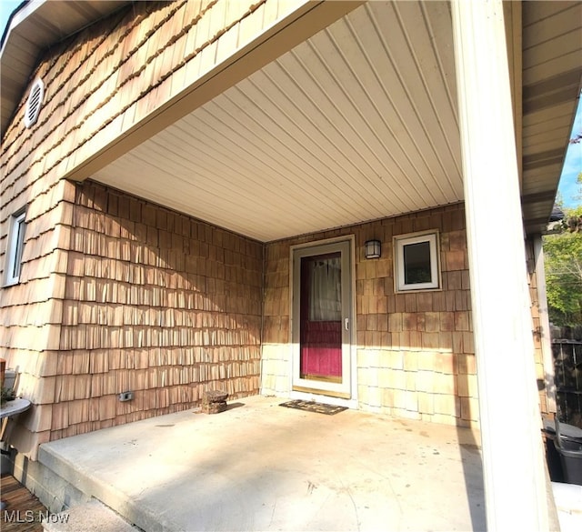 doorway to property featuring a patio