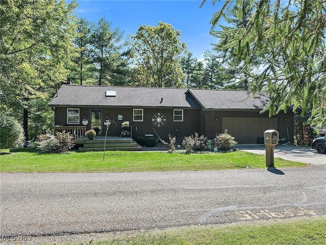 ranch-style house with a front lawn and a garage