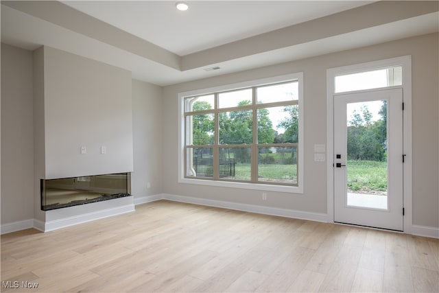 unfurnished living room featuring light hardwood / wood-style flooring