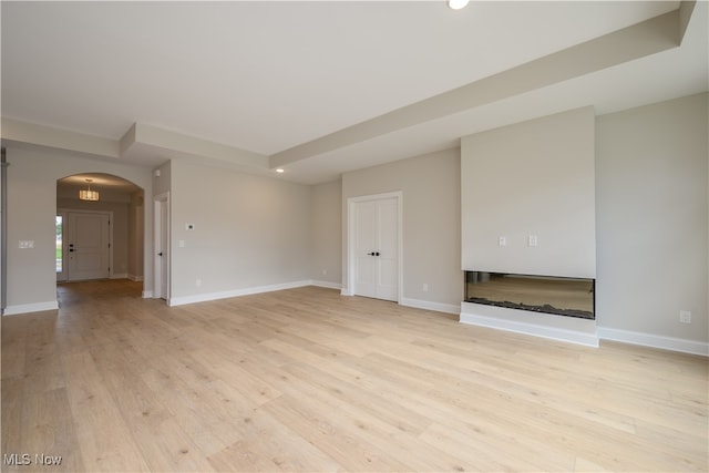 unfurnished living room featuring light hardwood / wood-style flooring