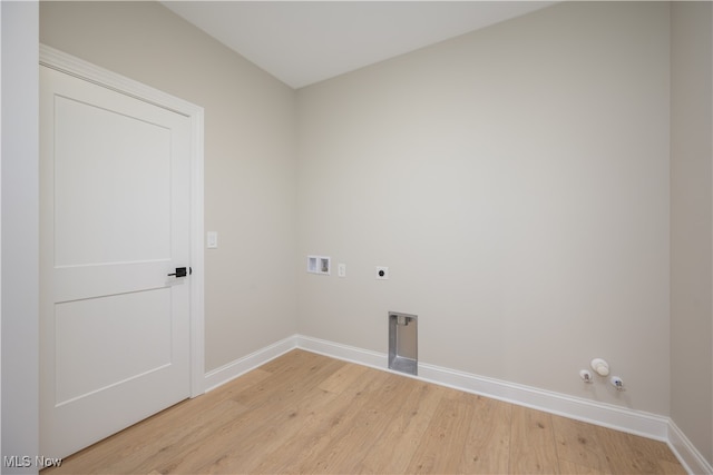 laundry area featuring light hardwood / wood-style floors, hookup for a washing machine, gas dryer hookup, and electric dryer hookup