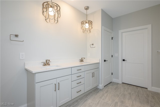 bathroom featuring vanity and an inviting chandelier