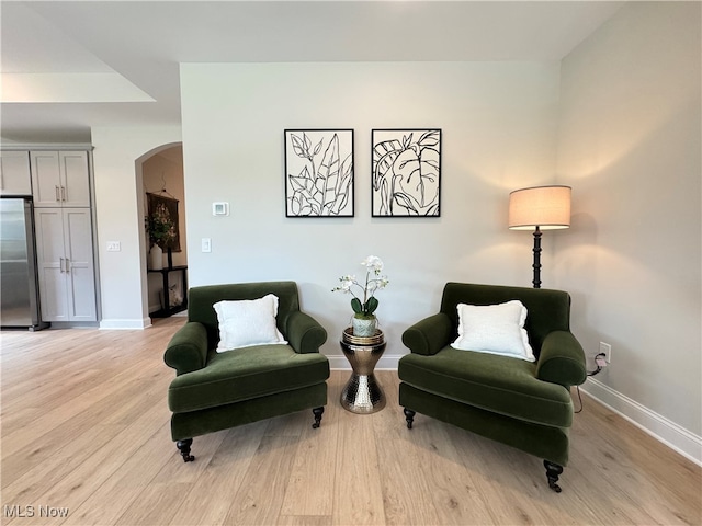 living area with light hardwood / wood-style flooring