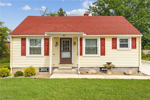 view of front of home with a front yard