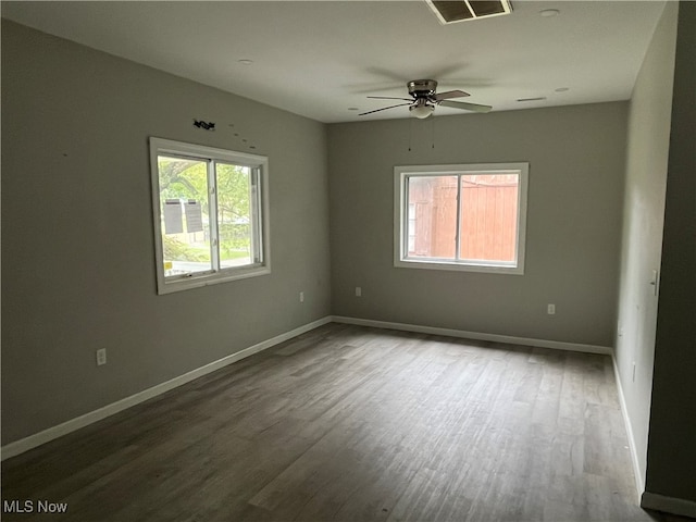 spare room featuring hardwood / wood-style floors and ceiling fan