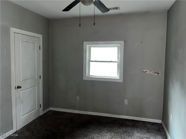 carpeted empty room with ceiling fan