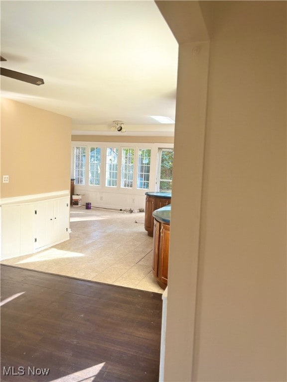 hallway with light hardwood / wood-style floors