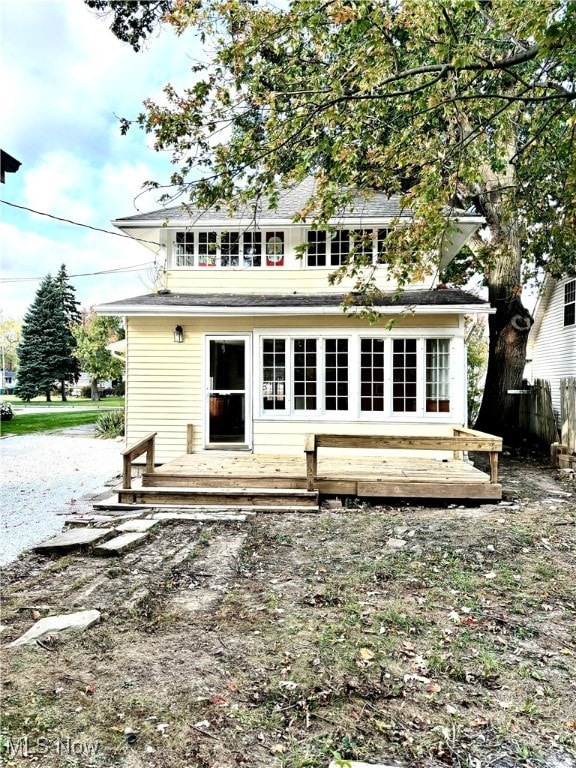 rear view of house with a deck