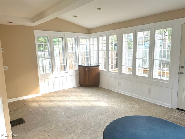 unfurnished sunroom with vaulted ceiling