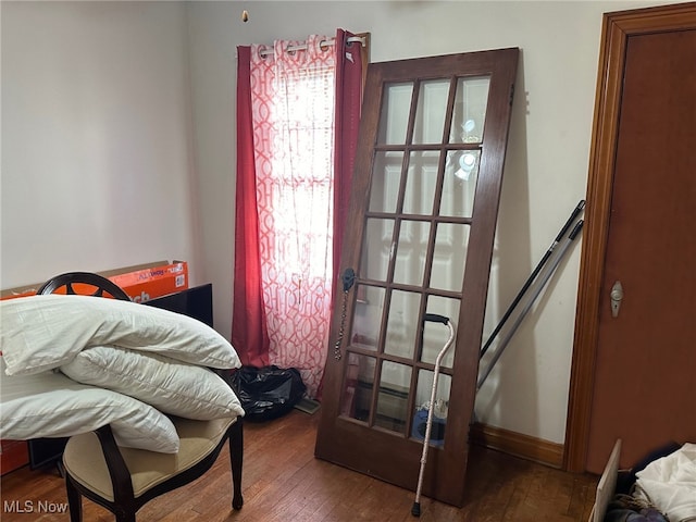 bedroom featuring dark hardwood / wood-style flooring