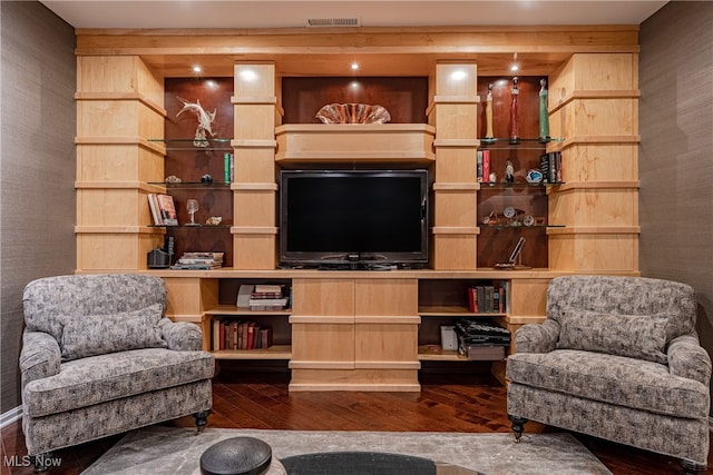 sitting room with dark wood-type flooring