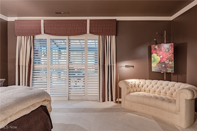 bedroom with carpet and crown molding