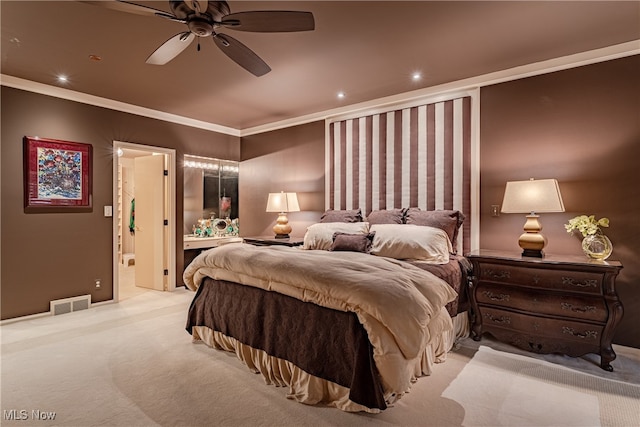 carpeted bedroom featuring ceiling fan, connected bathroom, and ornamental molding