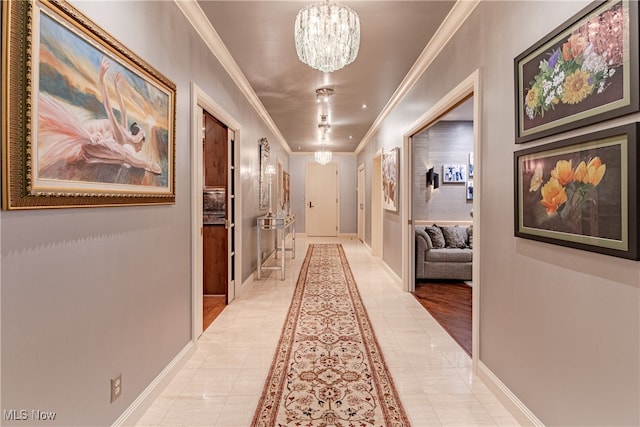 corridor with ornamental molding, a chandelier, and light tile patterned flooring