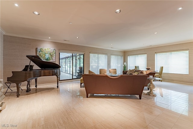 living room featuring ornamental molding and plenty of natural light