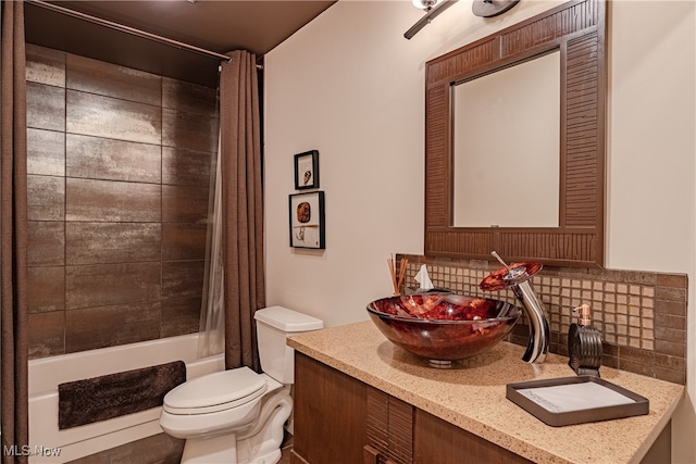 full bathroom with vanity, shower / bath combo with shower curtain, toilet, and backsplash